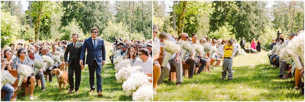 Snohomish Wedding Photographer GSquared Weddings Groomsmen in suits one with a dog walk down an outdoor aisle lined with guests holding white flowers A child in a yellow shirt follows with trees and greenery in the background under a clear sky Serving Seattle Snohomish and Washington State Snohomish Wedding Photographer GSquared Weddings Groomsmen in suits, one with a dog, walk down an outdoor aisle lined with guests holding white flowers. A child in a yellow shirt follows, with trees and greenery in the background under a clear sky. Serving Seattle, Snohomish and Washington State