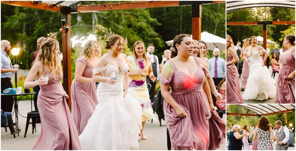 Snohomish wedding photographer gsquared weddings a bride in a white gown dances joyfully with bridesmaids in mauve dresses at an outdoor wedding reception Guests in formal attire gather around under a wooden pergola with greenery and soft lights in the background Serving seattle snohomish and washington state