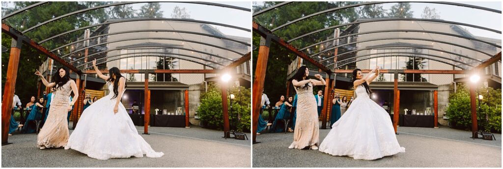 Snohomish wedding photographer gsquared weddings two women dancing outdoors under a clear canopy One wears a white wedding gown and the other a light colored embellished dress In the background guests are seated watching the performance amid greenery and a building with large windows Serving seattle snohomish and washington state
