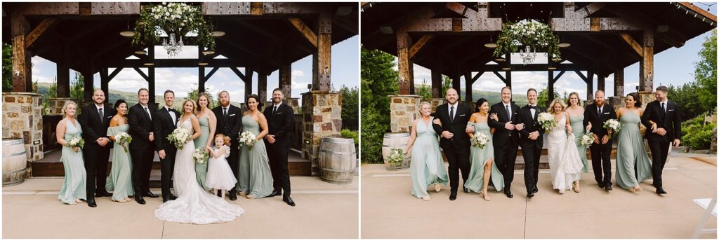 Snohomish Wedding Photographer GSquared Weddings Wedding party in formal attire poses and walks outside a rustic venue. The bridesmaids wear sage green dresses, and the groomsmen are in black suits. The bride is in a white gown. They are all smiling with greenery and wooden beams in the background. Serving Seattle, Snohomish and Washington State
