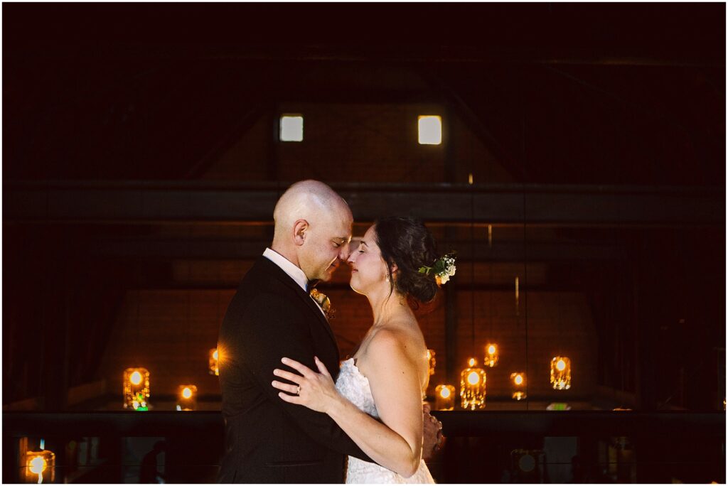 Snohomish wedding photographer gsquared weddings a couple in formal attire shares a tender moment gently touching foreheads The dimly lit background features a row of glowing lights and candles creating a romantic atmosphere Serving seattle snohomish and washington state Snohomish wedding photographer gsquared weddings a couple in formal attire shares a tender moment gently touching foreheads The dimly lit background features a row of glowing lights and candles creating a romantic atmosphere Serving seattle snohomish and washington state