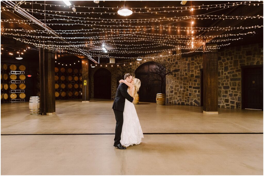 Snohomish wedding photographer gsquared weddings a bride and groom share a kiss in an empty warmly lit winery cellar adorned with string lights Wine barrels line one wall and the stone walls create a rustic ambiance The couple stands in the center of the spacious festive area Serving seattle snohomish and washington state Snohomish wedding photographer gsquared weddings a bride and groom share a kiss in an empty warmly lit winery cellar adorned with string lights Wine barrels line one wall and the stone walls create a rustic ambiance The couple stands in the center of the spacious festive area Serving seattle snohomish and washington state
