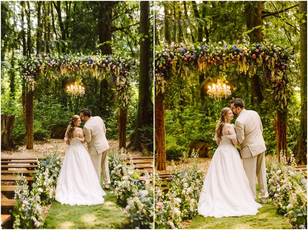 Snohomish wedding photographer gsquared weddings a couple shares a kiss during their wedding ceremony in a lush wooded setting They stand under a floral arch adorned with greenery and flowers The aisle is lined with floral arrangements and a chandelier hangs above them Serving seattle snohomish and washington state Snohomish wedding photographer gsquared weddings a couple shares a kiss during their wedding ceremony in a lush wooded setting They stand under a floral arch adorned with greenery and flowers The aisle is lined with floral arrangements and a chandelier hangs above them Serving seattle snohomish and washington state