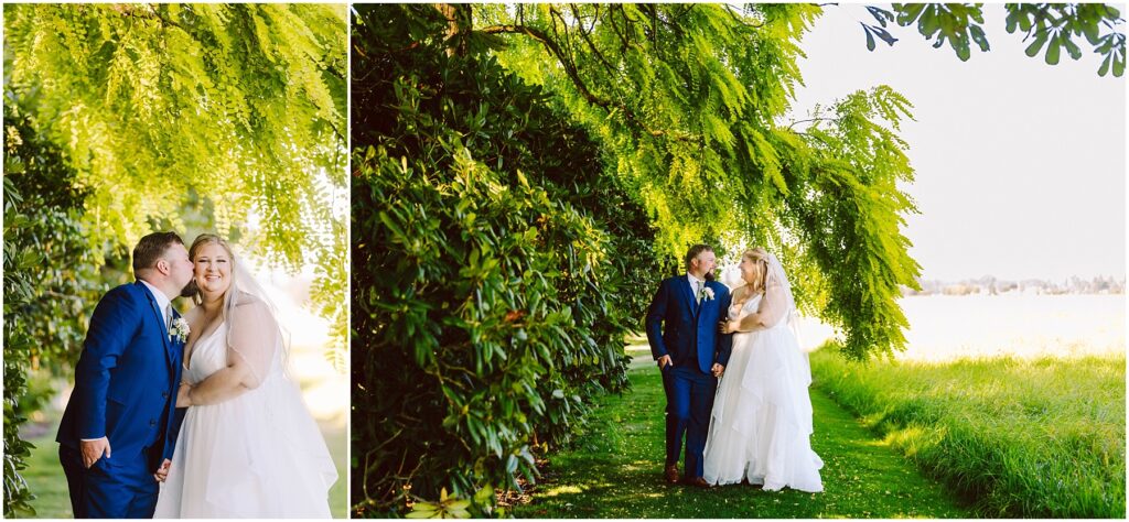 Snohomish wedding photographer gsquared weddings a couple in wedding attire stands under a large leafy tree surrounded by greenery The groom wears a blue suit and the bride wears a white gown They are smiling with the groom kissing the brides cheek in one image Sunlight filters through the leaves Serving seattle snohomish and washington state Snohomish wedding photographer gsquared weddings a couple in wedding attire stands under a large leafy tree surrounded by greenery The groom wears a blue suit and the bride wears a white gown They are smiling with the groom kissing the brides cheek in one image Sunlight filters through the leaves Serving seattle snohomish and washington state