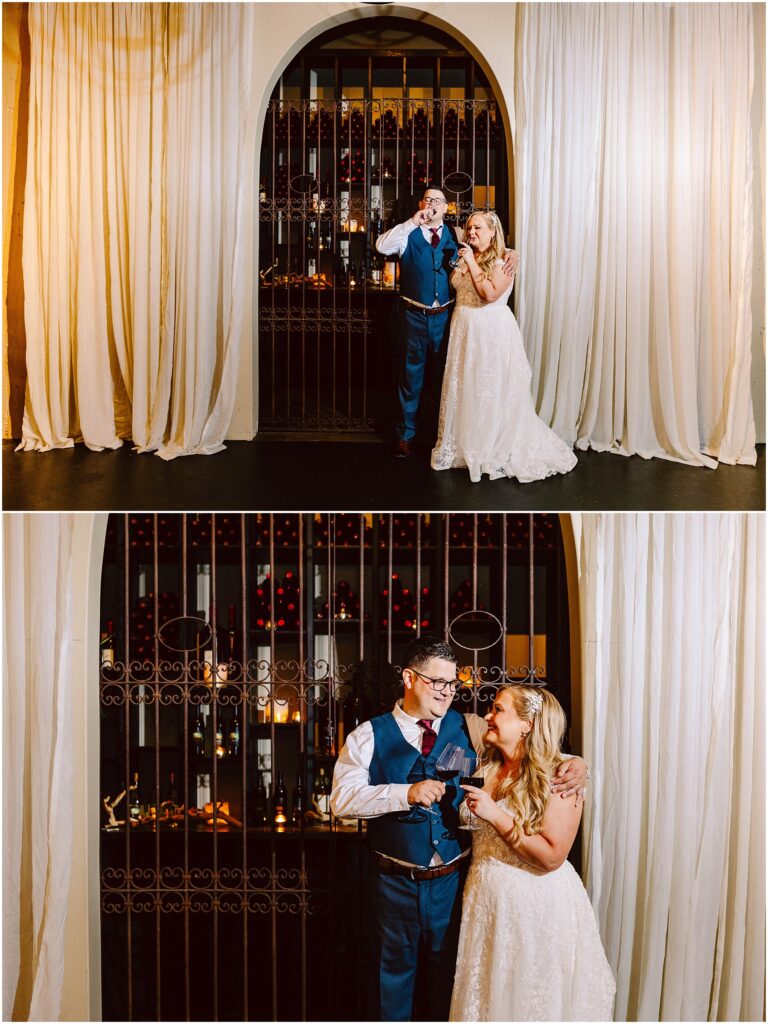 Snohomish wedding photographer gsquared weddings a couple in formal attire stands in front of a decorative gate The man is in a blue suit playfully posing and the woman in a white dress smiling and gesturing towards him They are surrounded by elegant white curtains Serving seattle snohomish and washington state Snohomish wedding photographer gsquared weddings a couple in formal attire stands in front of a decorative gate The man is in a blue suit playfully posing and the woman in a white dress smiling and gesturing towards him They are surrounded by elegant white curtains Serving seattle snohomish and washington state