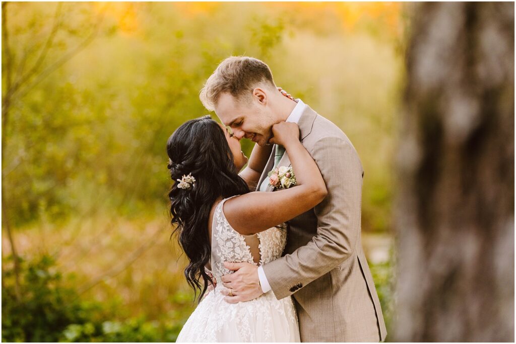 Snohomish wedding photographer gsquared weddings a bride and groom embrace tenderly outdoors The bride wears a white lace gown with a floral hairpiece and the groom is in a light tan suit They are surrounded by soft blurred greenery creating a romantic and intimate atmosphere Serving seattle snohomish and washington state Snohomish wedding photographer gsquared weddings a bride and groom embrace tenderly outdoors The bride wears a white lace gown with a floral hairpiece and the groom is in a light tan suit They are surrounded by soft blurred greenery creating a romantic and intimate atmosphere Serving seattle snohomish and washington state