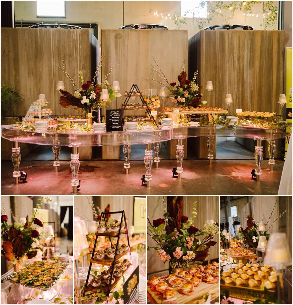 Snohomish Wedding Photographer GSquared Weddings An elegant buffet setup with a variety of gourmet appetizers displayed on glass tables. Decorative florals and candles enhance the presentation. The arrangement includes tiered trays with assorted finger foods, pastries, and a central menu board. Serving Seattle, Snohomish and Washington State