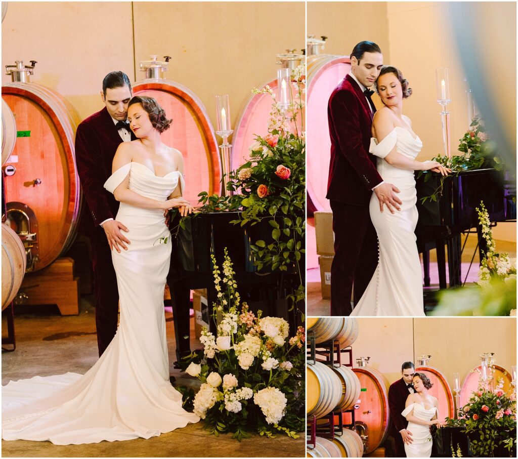 Snohomish Wedding Photographer GSquared Weddings A couple poses elegantly in a wine cellar. The woman, in a flowing white gown, and the man, in a velvet suit, embrace beside a piano adorned with flowers. Large wine barrels fill the backdrop, adding rustic charm to the romantic setting. Serving Seattle, Snohomish and Washington State