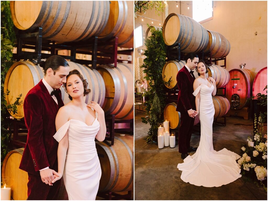 Snohomish Wedding Photographer GSquared Weddings A couple in formal attire poses in a winery. The woman wears an off-shoulder white gown, and the man wears a red velvet suit. They stand in front of wine barrels, surrounded by greenery and candles. The setting is elegant and romantic. Serving Seattle, Snohomish and Washington State
