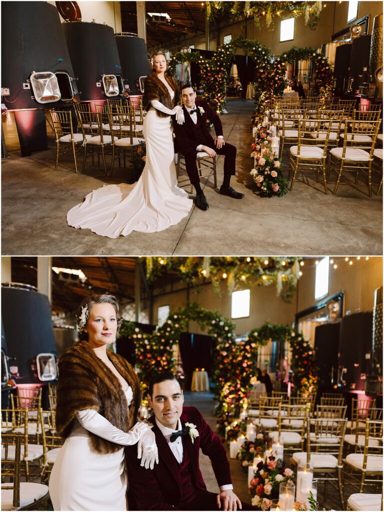 Snohomish Wedding Photographer GSquared Weddings A couple poses in an elegant wedding setting. The woman wears a white gown and fur stole, and the man dons a burgundy suit. Theyre surrounded by gold chairs, floral arrangements, and arches adorned with greenery inside a large venue. Serving Seattle, Snohomish and Washington State