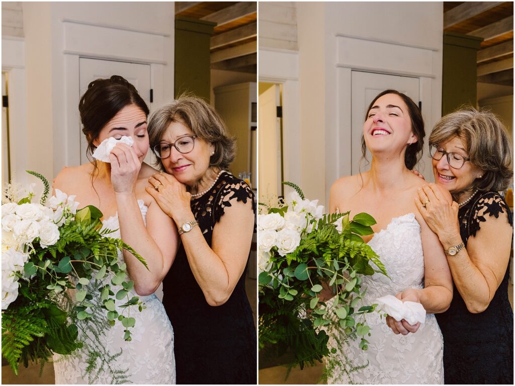 Snohomish Wedding Photographer GSquared Weddings A bride in a white dress holds a bouquet of white flowers and ferns, wiping tears with a tissue. An older woman in a black dress, beside her, smiles and comforts her. They both appear joyful in a bright indoor setting. Serving Seattle, Snohomish and Washington State