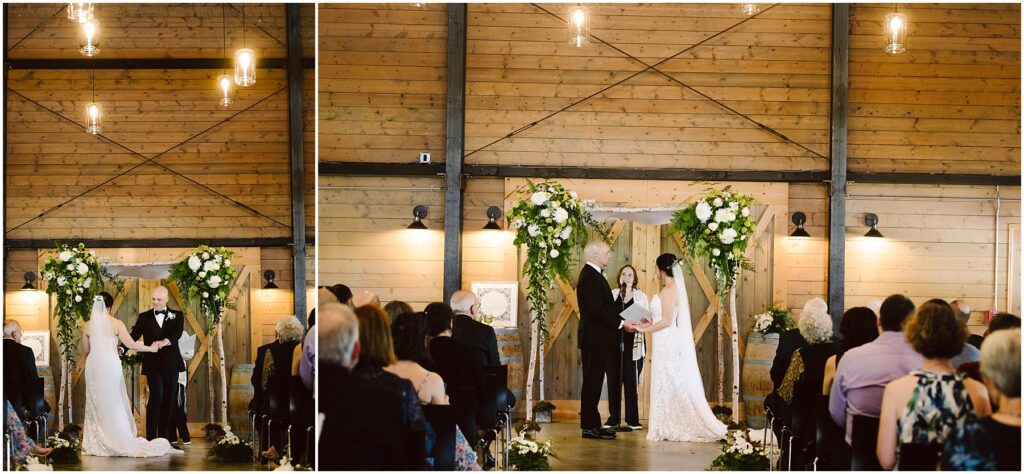 Snohomish Wedding Photographer GSquared Weddings A bride and groom stand before an officiant during a wedding ceremony in a rustic, wooden venue. Guests are seated on either side, and floral arrangements decorate the setting. The lighting is warm and ambient. Serving Seattle, Snohomish and Washington State