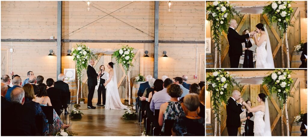 Snohomish Wedding Photographer GSquared Weddings A couple is getting married in a rustic venue with wooden walls and floral decorations. The bride and groom are under a floral arch. Guests are seated, watching the ceremony. The couple exchanges vows and perform a sand pouring ritual. Serving Seattle, Snohomish and Washington State
