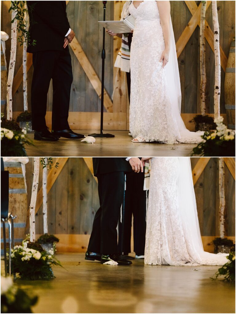 Snohomish Wedding Photographer GSquared Weddings A bride and groom stand under a rustic canopy during their wedding ceremony. The bride wears a lace gown, and the groom is in a black suit. White flowers and greenery decorate the wooden setting. A glass is seen on the floor, possibly for a traditional ritual. Serving Seattle, Snohomish and Washington State