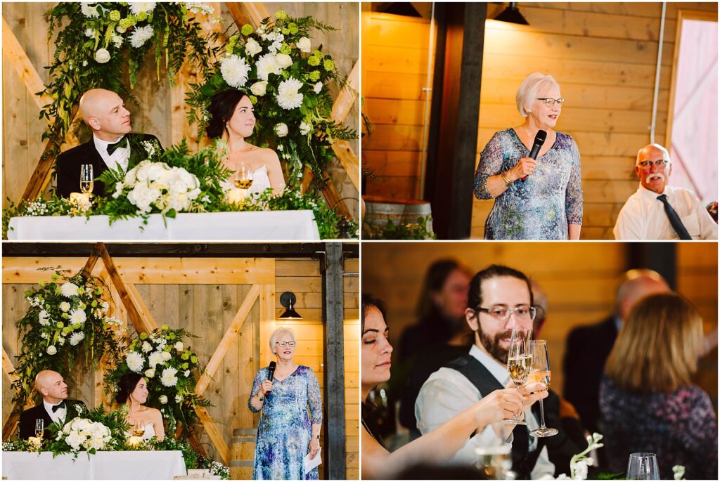 Snohomish Wedding Photographer GSquared Weddings A wedding scene with a couple at a beautifully decorated table. A woman in a blue dress gives a speech. Guests raise glasses in a toast. Wooden walls and floral arrangements create a rustic atmosphere. Serving Seattle, Snohomish and Washington State
