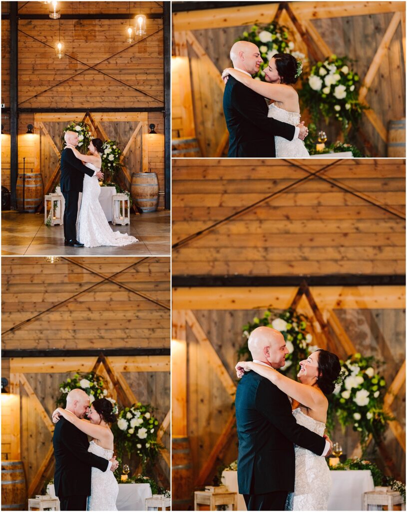 Snohomish Wedding Photographer GSquared Weddings A couple is having their first dance at a wedding. They are embracing in front of a rustic wooden backdrop with floral arrangements. The bride is wearing a white gown, and the groom is in a black suit. Warm lighting creates a romantic atmosphere. Serving Seattle, Snohomish and Washington State