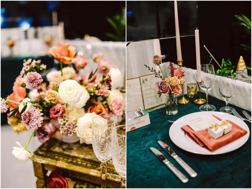 Snohomish Wedding Photographer GSquared Weddings A table setting with elegant flower arrangements featuring roses and greenery. A plate with a pink napkin, cutlery, a menu, and a gift box is placed beside wine glasses and tall candles on a green tablecloth. Serving Seattle, Snohomish and Washington State