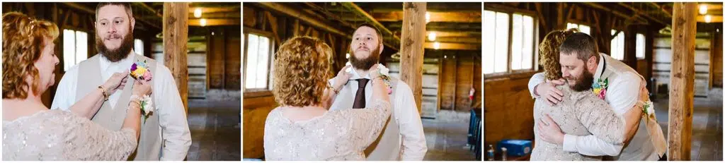 Snohomish Wedding Photographer GSquared Weddings In a rustic wooden venue reminiscent of Machias charm, a bearded man in a suit has his boutonniere pinned by a woman in a sparkly dress. They share warm smiles under the soft glow of windows and overhead bulbs, embracing warmly as if time stood still. Serving Seattle, Snohomish and Washington State