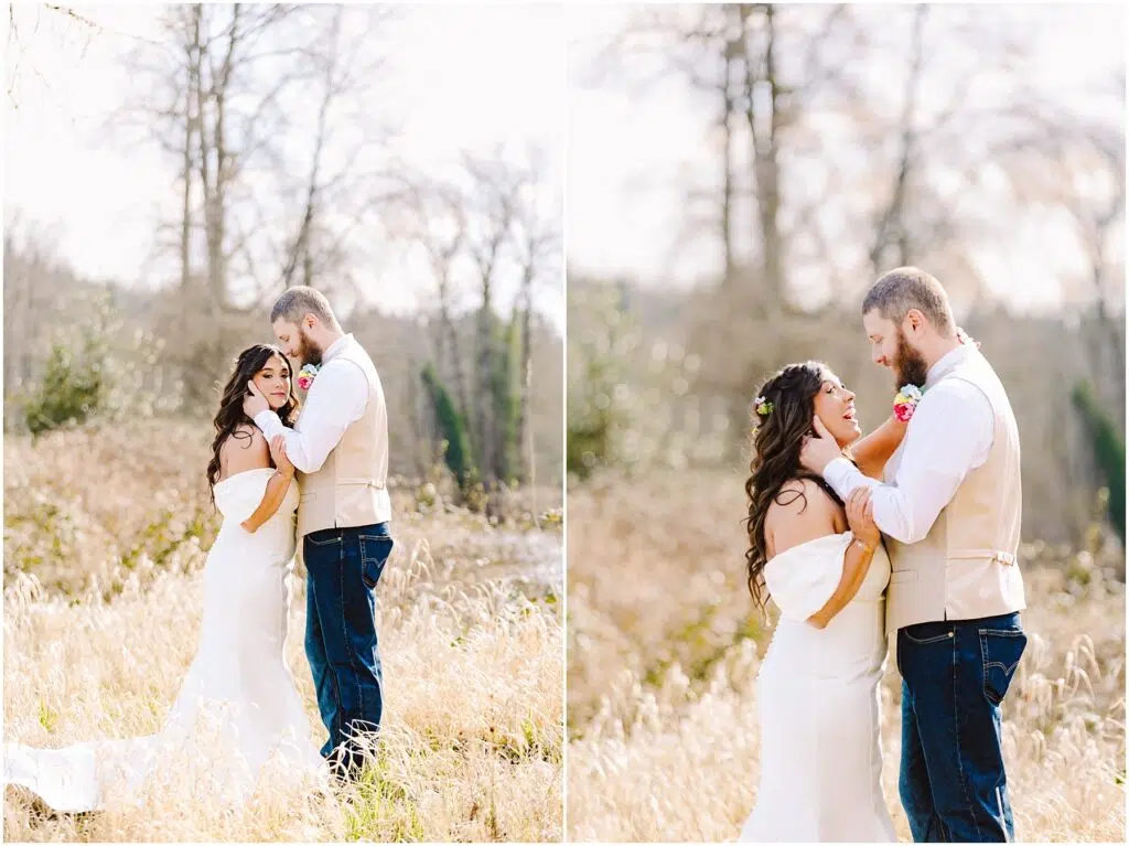 Snohomish Wedding Photographer GSquared Weddings A couple stands in a sunlit field near Machias, with the man wearing a beige vest and jeans and the woman in an off-the-shoulder white dress. They hold each other tenderly, surrounded by tall grasses and bare trees in the background. Serving Seattle, Snohomish and Washington State