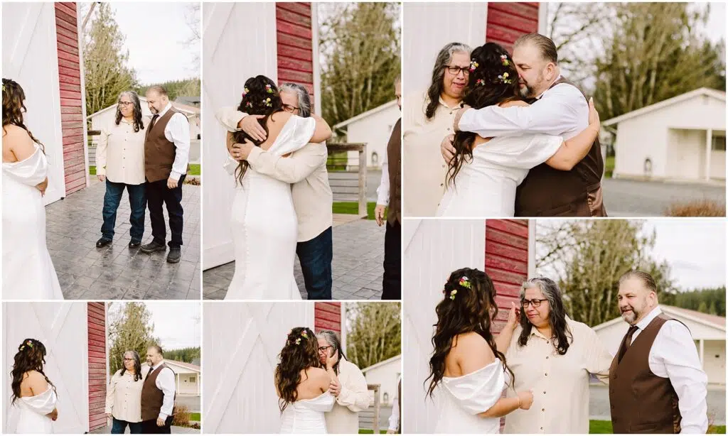 Snohomish Wedding Photographer GSquared Weddings A bride in a white dress with floral hair accessories hugs two individuals, a woman and a man, outside a red and white barn in Machias. They all share smiles and embrace in heartfelt poses against a backdrop of trees and a light-colored building. Serving Seattle, Snohomish and Washington State