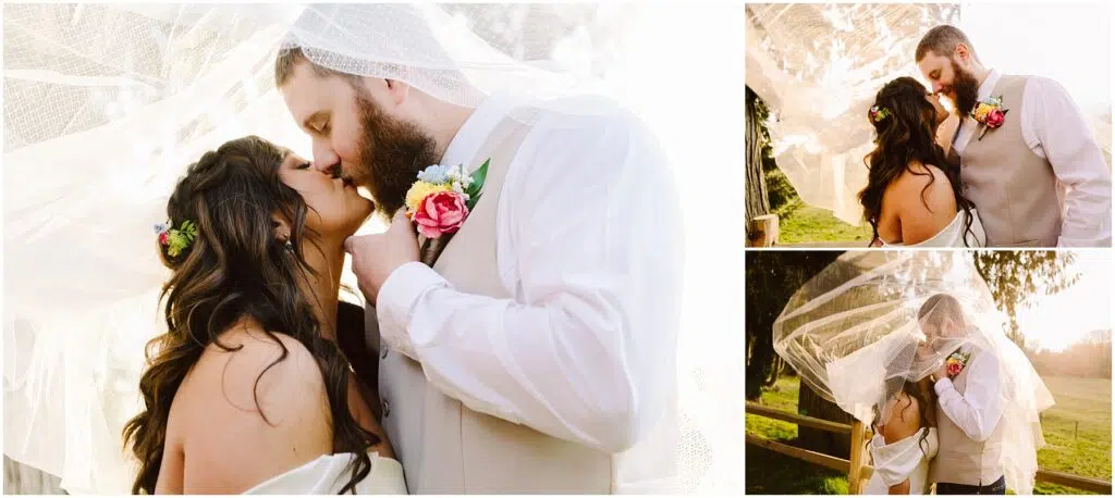 Snohomish Wedding Photographer GSquared Weddings A newlywed couple shares a romantic kiss under a flowing veil outdoors in Machias. The groom wears a beige suit and the bride, adorned with flowers in her hair, stands near a wooden fence surrounded by trees as the sun sets beautifully behind them. Serving Seattle, Snohomish and Washington State