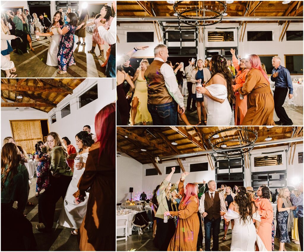 Snohomish Wedding Photographer GSquared Weddings Guests joyfully dance at a lively indoor wedding reception in Machias. They are in a spacious venue with wooden ceilings and modern chandeliers. People display a range of colorful outfits, adding to the festive atmosphere. Serving Seattle, Snohomish and Washington State