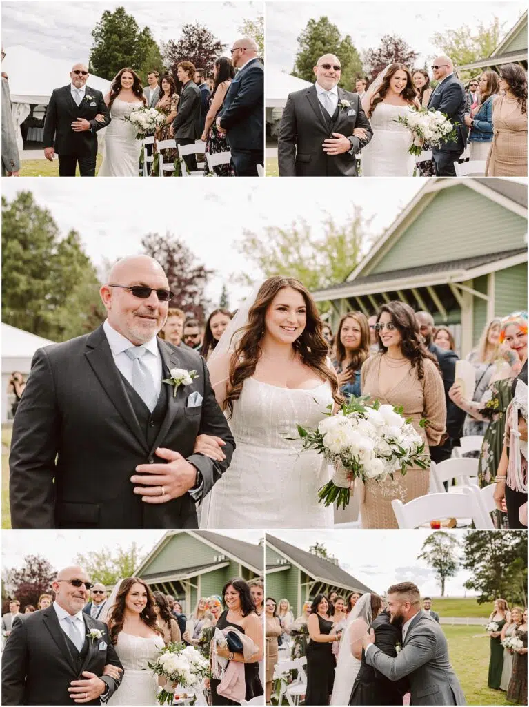 Snohomish Wedding Photographer GSquared Weddings In the charming setting of Port Gamble a bride in a white dress and a man in a dark suit walk down an outdoor aisle graced by the warmth of a beautiful summer wedding Guests watch some seated and others standing as the bride carries a bouquet of white flowers to meet someone for an embrace at the end Serving Seattle Snohomish and Washington State Snohomish Wedding Photographer GSquared Weddings In the charming setting of Port Gamble, a bride in a white dress and a man in a dark suit walk down an outdoor aisle, graced by the warmth of a beautiful summer wedding. Guests watch, some seated and others standing, as the bride carries a bouquet of white flowers to meet someone for an embrace at the end. Serving Seattle, Snohomish and Washington State