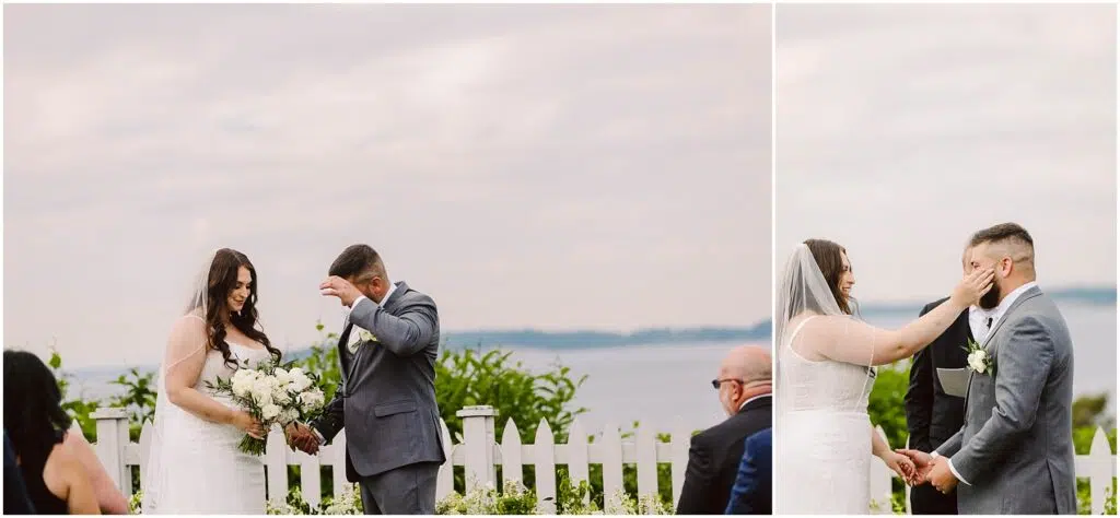 Snohomish Wedding Photographer GSquared Weddings A bride and groom stand outdoors by a white picket fence in Port Gamble The bride is in a white gown holding a bouquet while the groom is in a gray suit Both are smiling and adjusting their hair embodying the joy of their summer wedding against a backdrop of cloudy sky and distant water Serving Seattle Snohomish and Washington State Snohomish Wedding Photographer GSquared Weddings A bride and groom stand outdoors by a white picket fence in Port Gamble. The bride is in a white gown, holding a bouquet, while the groom is in a gray suit. Both are smiling and adjusting their hair, embodying the joy of their summer wedding against a backdrop of cloudy sky and distant water. Serving Seattle, Snohomish and Washington State