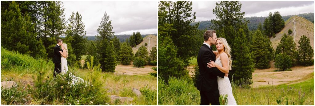 Snohomish Wedding Photographer GSquared Weddings A bride and groom embrace in a scenic outdoor winery setting with lush greenery and hills in the background. The bride wears a long white gown, and the groom is in a black suit. Pine trees and grassy fields surround them under a cloudy sky. Serving Seattle, Snohomish and Washington State