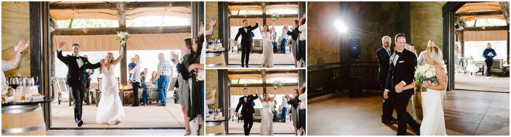 Snohomish Wedding Photographer GSquared Weddings A bride and groom, both smiling, joyfully enter a rustic winery reception hall. The bride is holding a bouquet, and both have their arms raised. Guests are clapping and celebrating in the background surrounded by charming wooden elements. Serving Seattle, Snohomish and Washington State