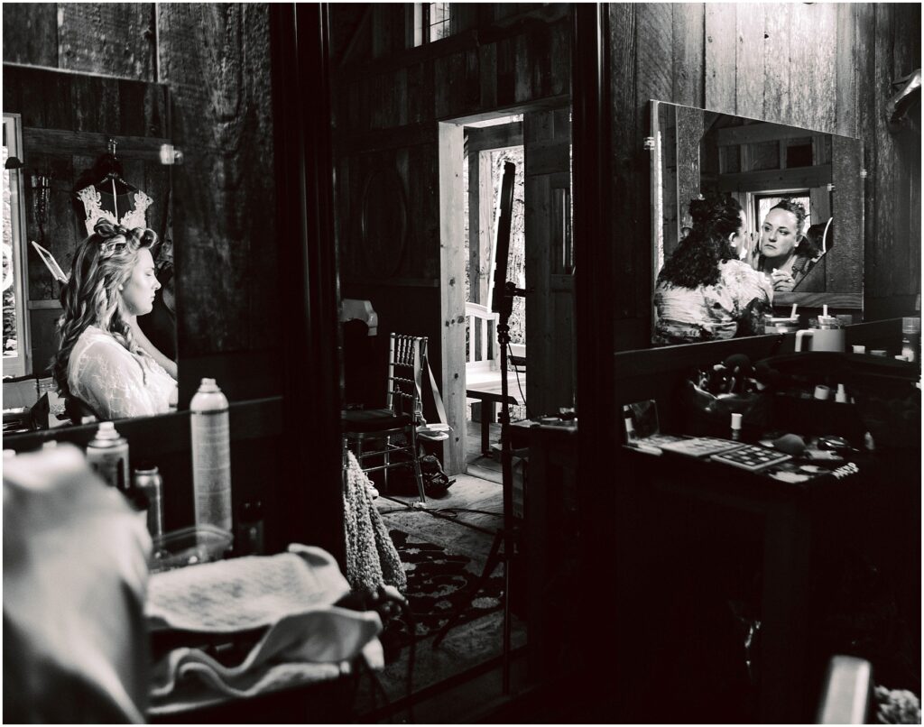 Snohomish Wedding Photographer GSquared Weddings In a rustic Snohomish room a bride sits before a mirror preparing for her wedding The reflection shows her smiling face amid wedding essentials An open door leads outside as natural light filters through the space Black and white photo Serving Seattle Snohomish and Washington State Snohomish Wedding Photographer GSquared Weddings In a rustic Snohomish room, a bride sits before a mirror, preparing for her wedding. The reflection shows her smiling face amid wedding essentials. An open door leads outside as natural light filters through the space. Black and white photo. Serving Seattle, Snohomish and Washington State