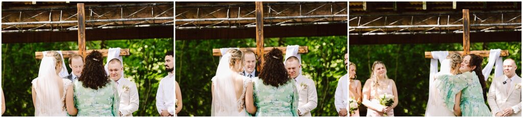 Snohomish Wedding Photographer GSquared Weddings In the serene setting of Snohomish a bride and groom stand before a wooden cross joined by two companions One in a light green dress offers an embrace Towering trees and a rustic wooden structure frame this picturesque moment Serving Seattle Snohomish and Washington State Snohomish Wedding Photographer GSquared Weddings In the serene setting of Snohomish, a bride and groom stand before a wooden cross, joined by two companions. One, in a light green dress, offers an embrace. Towering trees and a rustic wooden structure frame this picturesque moment. Serving Seattle, Snohomish and Washington State