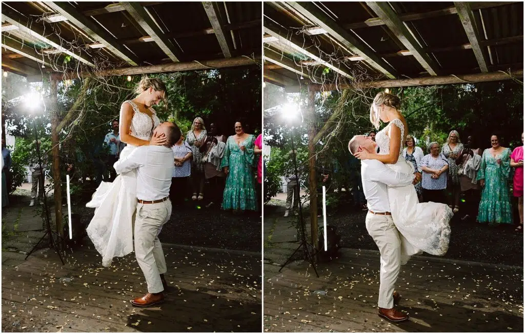 Snohomish Wedding Photographer GSquared Weddings A groom lifts the bride joyfully under a wooden pergola in Snohomish Guests stand in the background smiling The bride wears a white gown and the groom is in lightcolored attire The scene is festive with string lights and scattered petals Serving Seattle Snohomish and Washington State Snohomish Wedding Photographer GSquared Weddings A groom lifts the bride joyfully under a wooden pergola in Snohomish. Guests stand in the background, smiling. The bride wears a white gown, and the groom is in light-colored attire. The scene is festive with string lights and scattered petals. Serving Seattle, Snohomish and Washington State