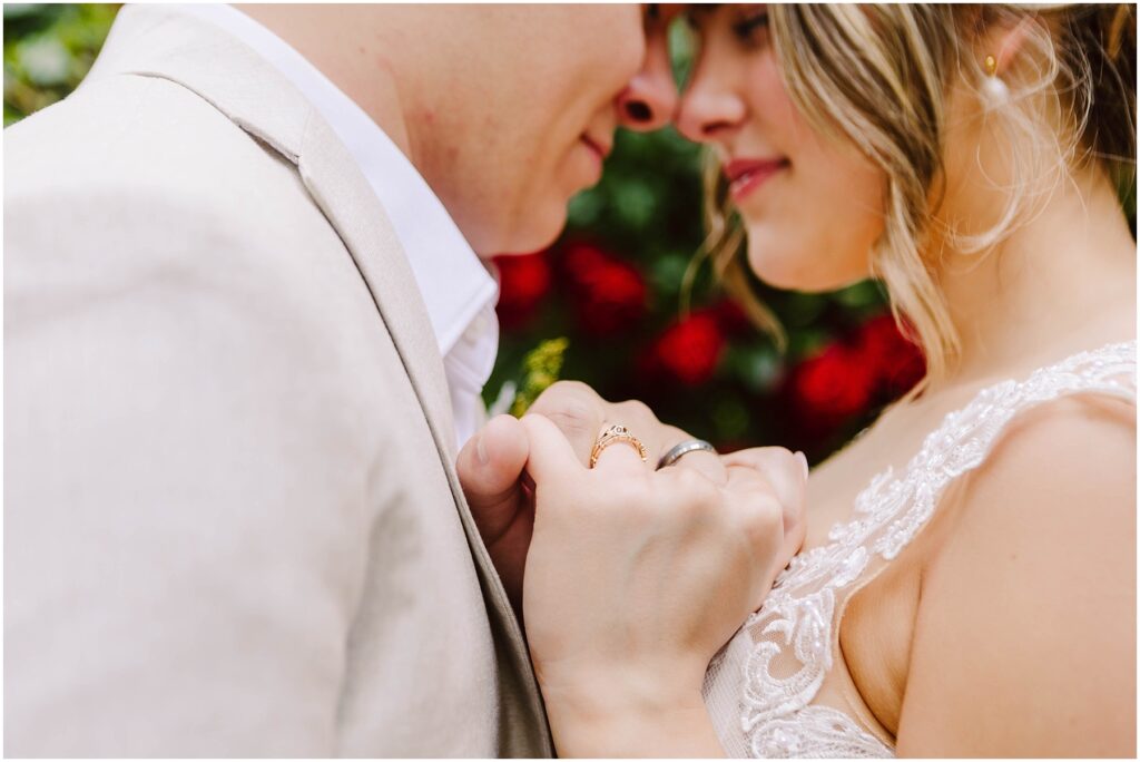 Snohomish Wedding Photographer GSquared Weddings A couple stands close in Snohomish touching foreheads and holding hands gently The womans engagement ring is visible Both are wearing lightcolored clothing with blurred red flowers in the background creating a romantic atmosphere Serving Seattle Snohomish and Washington State Snohomish Wedding Photographer GSquared Weddings A couple stands close in Snohomish, touching foreheads and holding hands gently. The womans engagement ring is visible. Both are wearing light-colored clothing, with blurred red flowers in the background, creating a romantic atmosphere. Serving Seattle, Snohomish and Washington State
