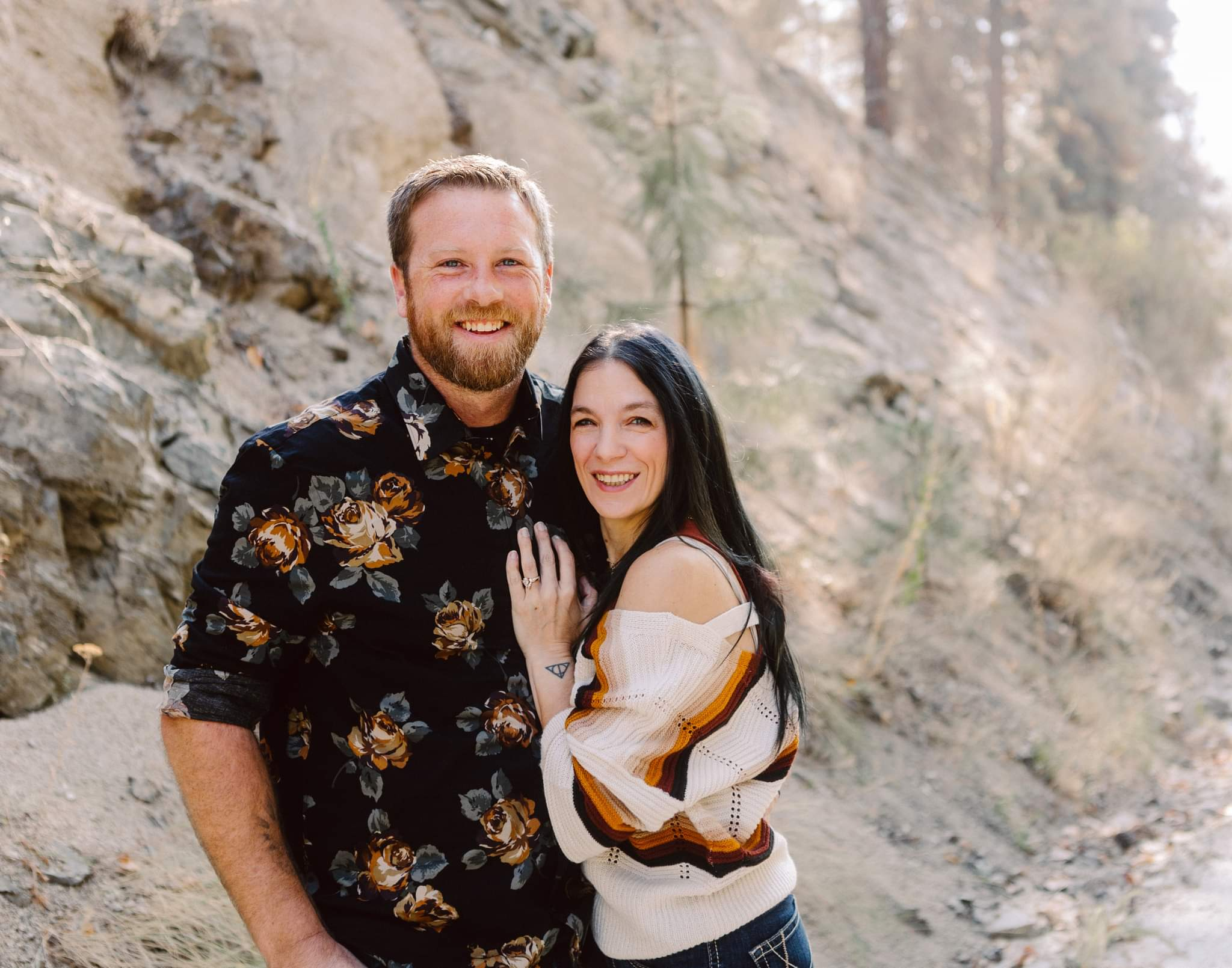 Premier Snohomish Seattle Wedding Photographer | GSquared Weddings Photography A smiling man and woman stand close together outdoors by a rocky hillside Captured in a Seattle Snohomish Wedding Photography style the man wears a dark floral shirt while the woman in a striped sweater rests her hand on his chest Both appear happy 479129° N 1220982° W | Candid wedding photo by GSquared Weddings Premier Snohomish & Seattle Wedding Photographer | GSquared Weddings Photography A smiling man and woman stand close together outdoors by a rocky hillside Captured in a Seattle Snohomish Wedding Photography style the man wears a dark floral shirt while the woman in a striped sweater rests her hand on his chest Both appear happy 479129° N 1220982° W | Candid wedding photo by GSquared Weddings