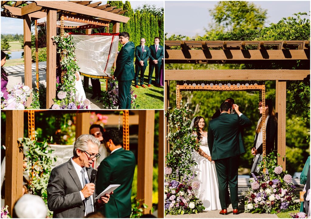 Outdoor wedding ceremony under a wooden arbor bride and groom facing officiant with bridal party in background surrounded by floral arrangements