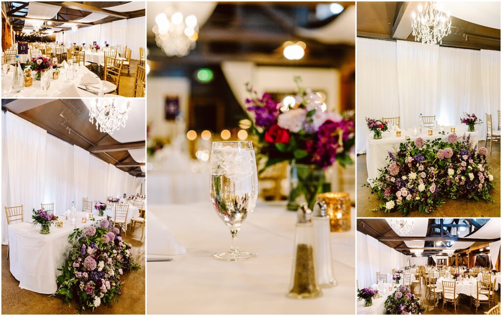 Wedding reception hall with white draped walls gold chairs and tables set with white linens and purple pink floral centerpieces